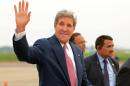 US Secretary of State John Kerry waves upon his arrival at Palam Air Base in New Delhi on July 30, 2014