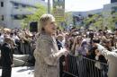 Democratic presidential candidate Hillary Clinton speaks to people in the overflow area during a campaign event at the Los Angeles Southwest College on Saturday, April 16, 2016, in Los Angeles. (AP Photo/Jae C. Hong)