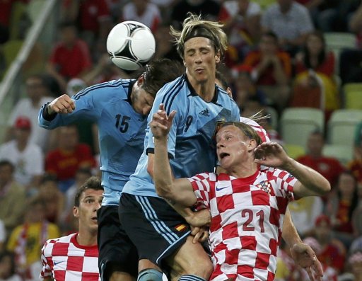 Spain's Ramos, Spain's Torres and Croatia's Vida jump for the ball during their Group C Euro 2012 soccer match at the PGE Arena in Gdansk