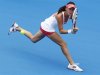 Radwanska of Poland hits a return to Date-Krumm of Japan during their women's singles match at the Sydney International tennis tournament