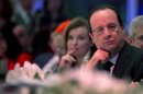 France's President Hollande and his companion Valerie Trierweiler attend the annual Representative Council of France's Jewish Associations dinner at the Pavillon d'Armenonville in Paris