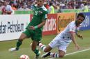 Iraq's Dhurgham Ismael (L) and Iran's Masoud Shojaei during their Asian Cup match in Canberra on January 23, 2015