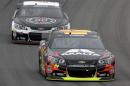 Jeff Gordon (24) races Kevin Harvick during the NASCAR Sprint Cup Series Pure Michigan 400 auto race at Michigan International Speedway in Brooklyn, Mich., Sunday, Aug. 17, 2014. (AP Photo/Paul Sancya)