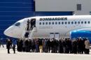Shareholders line up to view Bombardier's CS300 aircraft following their annual general meeting in Mirabel, Quebec