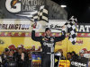 Jimmie Johnson poses for photographers in victory lane after winning the NASCAR Sprint Cup Series auto race, Saturday, May 12, 2012, at Darlington Raceway in Darlington, S.C. (AP Photo/Willis Glassgow)