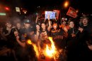 San Francisco Giants fans celebrate outside PacBell Park on Sunday, Oct. 28, 2012, in San Francisco after the Giants swept baseball's World Series against the Detroit Tigers. (AP Photo/Noah Berger)