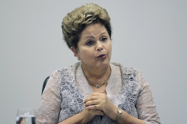 Brazil's President Dilma Rousseff speaks during the first meeting of the newly-formed CIASN, an interministerial committee for simplifying tax collection, at the Planalto Palace in Brasilia, February 12, 2014. The CIASN is being assigned the task of improving support for small businesses in Brazil. REUTERS/Ueslei Marcelino (BRAZIL - Tags: POLITICS BUSINESS)
