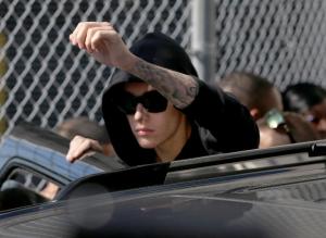 Justin Bieber prepares to stand on his vehicle after&nbsp;&hellip;