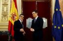 Spanish Parliament chairman Lopez and Socialists leader Sanchez pose before their meeting in Parliament in Madrid