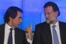 Spain's centre-right People's Party leader Rajoy and Former Spanish prime minister Aznar talk before a national executive committee in Madrid
