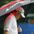 Chad Campbell keeps away from the rain during the final round of the Wyndham Championship golf tournament in Greensboro, N.C., Sunday, Aug. 19, 2012. (AP Photo/Gerry Broome)