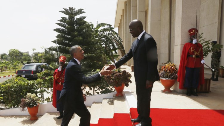 U.S. President Barack Obama is greeted by Chief Justice Oumar Sakho upon his arrival at the Supreme Court in Dakar