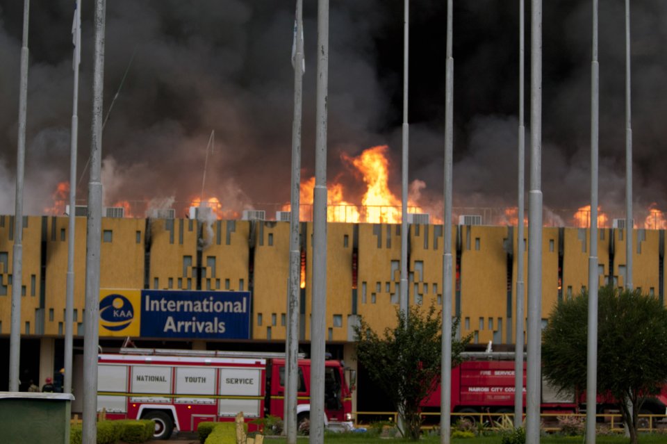 A blaze rages the International arrivals hall at Jomo Kenyatta International Airport in Nairobi, Kenya Wednesday, Aug. 7, 2013. The Kenya Airports Authority said the Kenya's main international airport has been closed until further notice so that emergency teams can battle the fire. (AP Photo/Sayyid Azim)