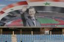 A poster of Syrian President Bashar al-Assad at a football stadium in Damascus on March 4, 2016