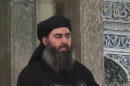 FILE -This file image made from video posted on a militant website on Saturday, July 5, 2014, which has been authenticated based on its contents and other AP reporting, purports to show the leader of the Islamic State group, Abu Bakr al-Baghdadi, greeting people before delivering a sermon at a mosque in Iraq. Across the broad swath of territory it controls from northern Syria through northern and western Iraq, the extremist group known as the Islamic State has proven to be highly organized governors. (AP Photo/Militant video, File)