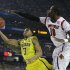 Michigan guard Trey Burke (3) shoots against Louisville center Gorgui Dieng (10) during the first half of the NCAA Final Four tournament college basketball championship game Monday, April 8, 2013, in Atlanta. (AP Photo/David J. Phillip)