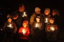 Mourners gather for a candlelight vigil at Ram's Pasture to remember shooting victims, Saturday, Dec. 15, 2012 in Newtown, Conn. A gunman walked into Sandy Hook Elementary School in Newtown Friday and opened fire, killing 26 people, including 20 children. (AP Photo/Jason DeCrow)