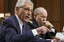Defense Secretary Chuck Hagel, left, and Army Gen. Martin Dempsey, chairman of the Joint Chiefs of Staff, appear before the Senate Armed Services Committee, the first in a series of high-profile Capitol Hill hearings that will measure the president's ability to rally congressional support for President Barack Obama's strategy to combat Islamic State extremists in Iraq and Syria, in Washington, Tuesday, Sept. 16, 2014. Obama last week outlined his military plan to destroy the extremists, authorizing U.S. airstrikes inside Syria, stepping up attacks in Iraq and deploying additional American troops, with more than 1,000 now advising and assisting Iraqi security forces to counter the terrorism threat. (AP Photo/J. Scott Applewhite)