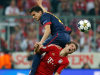 Barcelona's Marc Bartra, left, jumps on Bayern's Thomas Muller, a foul for which he was shown a yellow card, during the Champions League semifinal first leg soccer match between Bayern Munich and FC Barcelona in Munich, Germany, Tuesday, April 23, 2013. (AP Photo/Matthias Schrader)