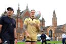 In this photo taken Thursday May 19, 2016, Gordon Tietjens, left, the New Zealand rugby 7's coach, with Sonny Bill Williams, watches his players train at Dulwich College in London. The mere length of Tietjens' tenure as New Zealand's rugby sevens coach, 22 years and counting, is extraordinary, even before considering his remarkable record of success. In the 17-year history of the sevens world series, Tietjens' teams have won 12 of them, including the first six. There's also two Sevens World Cup titles, and four Commonwealth Games gold medals. (AP Photo/Alastair Grant)
