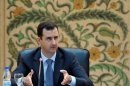 Syrian President Bashar al-Assad addresses his new cabinet during a swear-in ceremony in Damascus on June 23