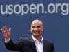 Two-time U.S. Open champion Agassi waves before being inducted into the U.S. Open Court of Champions in New York