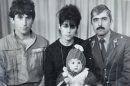 Baby Tamerlan Tsarnaev (center) poses with his mother, father (left) and uncle in this undated photo. 