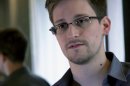 FILE - This June 9, 2013 photo provided by The Guardian newspaper in London shows Edward Snowden, who worked as a contract employee at the U.S. National Security Agency, in Hong Kong. The Guardian newspaper says that the British eavesdropping agency GCHQ repeatedly hacked into foreign diplomats' phones and emails when the U.K. hosted international conferences, even going so far as to set up a bugged Internet café in an effort to get an edge in high-stakes negotiations. The Guardian cites more than half a dozen internal government documents provided by former NSA contractor Edward Snowden as the basis for its reporting on GCHQ's intelligence operations. (AP Photo/The Guardian, File)