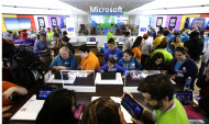 <p> In this Thursday, June 20, 2013, photo, people crowd the aisles during the grand opening of a Microsoft retail store in downtown Portland, Ore. Microsoft Corp. reports quarterly financial results after the market closes on July, 18, 2013. (AP Photo/Don Ryan)