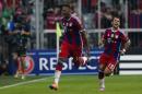 Bayern's Jerome Boateng, left, celebrates after he scored his side first goal during the Champions League Group E soccer match between FC Bayern Munich and Manchester City at Allianz Arena in Munich, southern Germany, Wednesday Sept. 17, 2014. Right are Bayern's Juan Bernat. (AP Photo/Matthias Schrader)