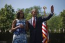 President Barack Obama and first lady Michelle Obama at the Vietnam Memorial on the National Mall in Washington, Monday, May 28, 2012. (AP Photo/Pablo Martinez Monsivais)
