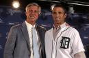 Detroit Tigers General Manager Dave Dombrowski and newly named Tigers manager Brad Ausmus pose together during a press conference in Detroit