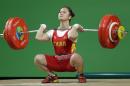 Deng Wei, of China, competes in the women's 63kg weightlifting competition at the 2016 Summer Olympics in Rio de Janeiro, Brazil, Tuesday, Aug. 9, 2016. (AP Photo/Mike Groll)