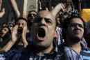 Egyptian protesters chant anti-ruling military council slogans during a rally demanding the release of fellow activists, detained during the army operation that dispersed a protest in front of the Ministry of Defense, in Cairo, Egypt Sunday, May 6, 2012. (AP Photo/Nasser Nasser)