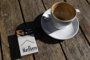 A Marlboro cigarettes pack, a brand of Philip Morris Tobacco, lies next to an empty coffee cup at a cafe in central Sydney