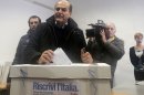 Pier Luigi Bersani, leader of the center-left Democratic Party, casts his vote during a primary runoff, in Piacenza, Italy, Sunday, Dec. 2, 2012. Italians are choosing a center-left candidate for premier for elections early next year, an important primary runoff given the main party is ahead in the polls against a center-right camp in utter chaos over whether Silvio Berlusconi will run again. Sunday's runoff pits veteran center-left leader Pier Luigi Bersani, 61, against the 37-year-old mayor of Florence, Matteo Renzi, not shown, who has campaigned on an Obama-style "Let's change Italy now" mantra. (AP Photo/Antonio Calanni)