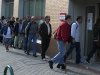 People enter an unemployment registry office in Madrid, Spain Monday May 6, 2013. Spain’s Labor Ministry said the number of people registered as unemployed fell by 46,050 in April with more people finding jobs in the run-up to the summer tourist season. Spain has been in recession for the best part of the past four years as the economy battles to recover from the collapse of its once-booming real estate sector. The total number registered as jobless stands at 4.99 million. (AP Photo/Paul White)