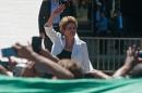 Brazil's suspended President Dilma Rousseff waves to supporters before giving a speech in front of the Planalto Palace in Brasilia on May 12, 2016