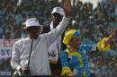 Chad's incumbent president Idriss Deby Itno (L) and his wife Inda (R) waving to supporters at the Ndjamena stadium during a presidential campaign rally on April 8, 2016