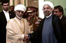 Iranian President Hassan Rowhani (R) and Oman's Sultan Qaboos bin Said (L) at Tehran's Saadabad Palace, August 25, 2013