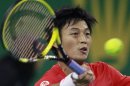 Taiwan's Yen-Hsun Lu hits a return during his single's tennis match against Switzerland's Roger Federer at the Shanghai Masters tournament in Shanghai