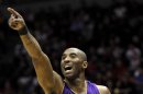 File photo of Los Angeles Lakers' Kobe Bryant points while playing against the Milwaukee Bucks in the first half during their NBA basketball game in Milwaukee, Wisconsin