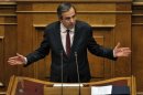 Grecia aprueba los presupuestos con recortes pedidos por UE y FMI