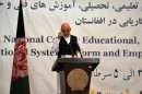 Afghan President Hamid Karzai addresses a seminar aimed at reforming Afghanistan's educational system in Kabul