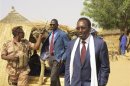 Mali's interim President Traore tours the village of Toulel