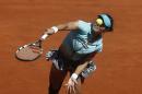 Na Li from China serves during a Madrid Open tennis tournament match against Kirsten Flipkens from Belgium, in Madrid, Spain, Monday, May 5, 2014. (AP Photo/Andres Kudacki)