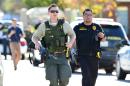 Police patrol the scene of a mass shooting on December 2, 2015 in San Bernardino, California, where one or more gunmen opened fire inside a building, leaving at least 14 dead