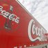 Trucks containing cases of Coca-Cola sit outside a warehouse at the Swire Coca-Cola facility in Draper
