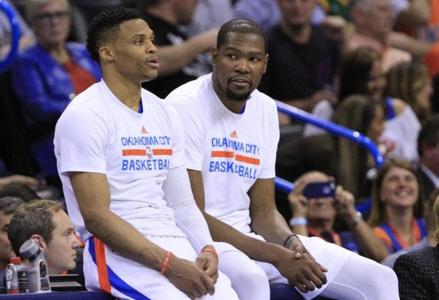 Kevin Durant, right, says he never told Russell Westbrook he was staying in Oklahoma City. (AP)
