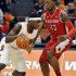 Syracuse's C.J. Fair, left, drives against Rutgers' Wally Judge during the first half of an NCAA college basketball game in Syracuse, N.Y., Wednesday, Jan. 2, 2013. (AP Photo/Kevin Rivoli)